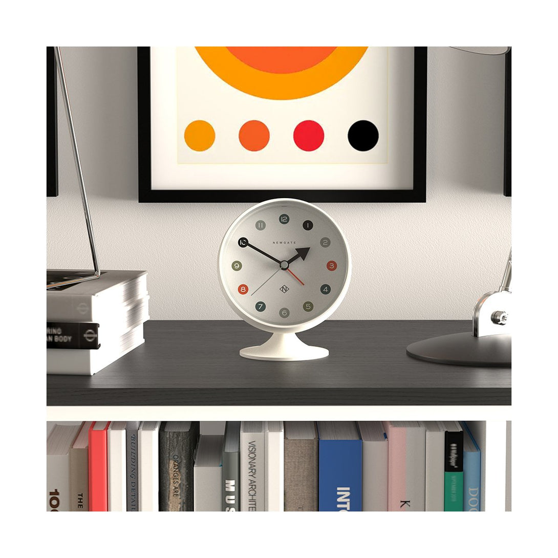 Front style shot view of the Retro Spheric alarm clock by Newgate World with an Arabic dial and a Pebble White case