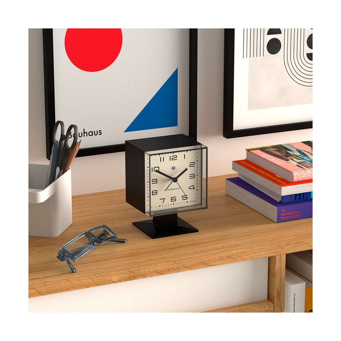 Retro Victor alarm clock by Newgate Clocks with a square case and an Arabic dial in matt black - Style Shot Skew View