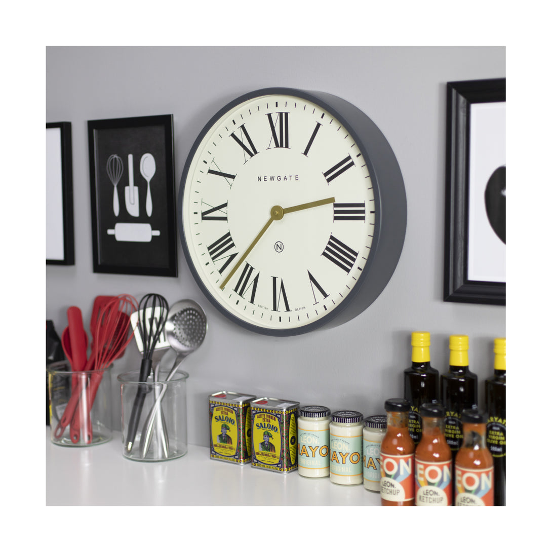 Side view of the Blizzard Grey large Mr Butler Wall clock by Newgate World in a kitchen setting