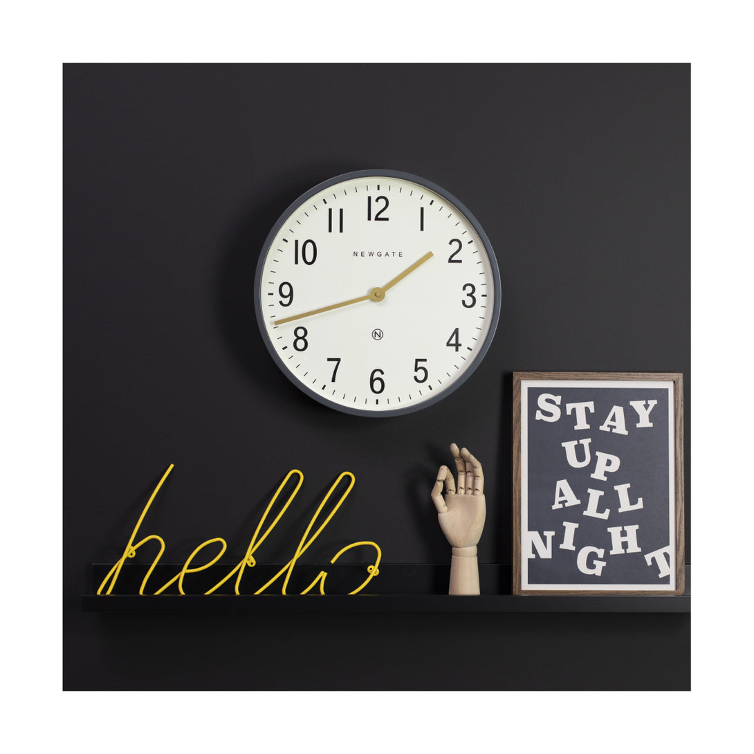 Large Grey Mr Edwards wall clock by Newgate World in Blizzard Grey with a cream Arabic dial and gold hands on a wall