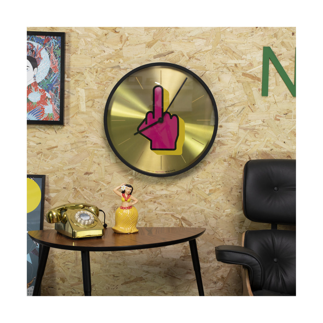 Newgate Clocks Limited Edition Up Yours wall clock with spun brass dial and large black case on a wall 