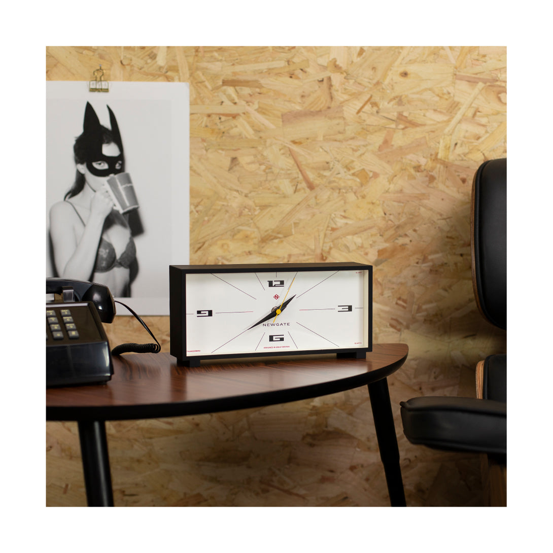 Newgate Clocks rectangular Thunderbird mantel clock with a cream dial and black case on a table