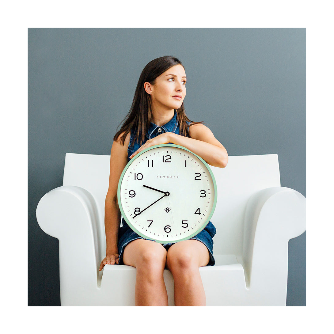 Neo Mint Number Three wall clock by Newgate World with lady on a white chair - NUMTHR129NM